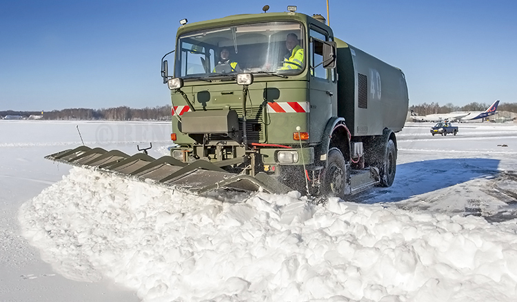 Winter snow airport cleaning service at Twente Airport.